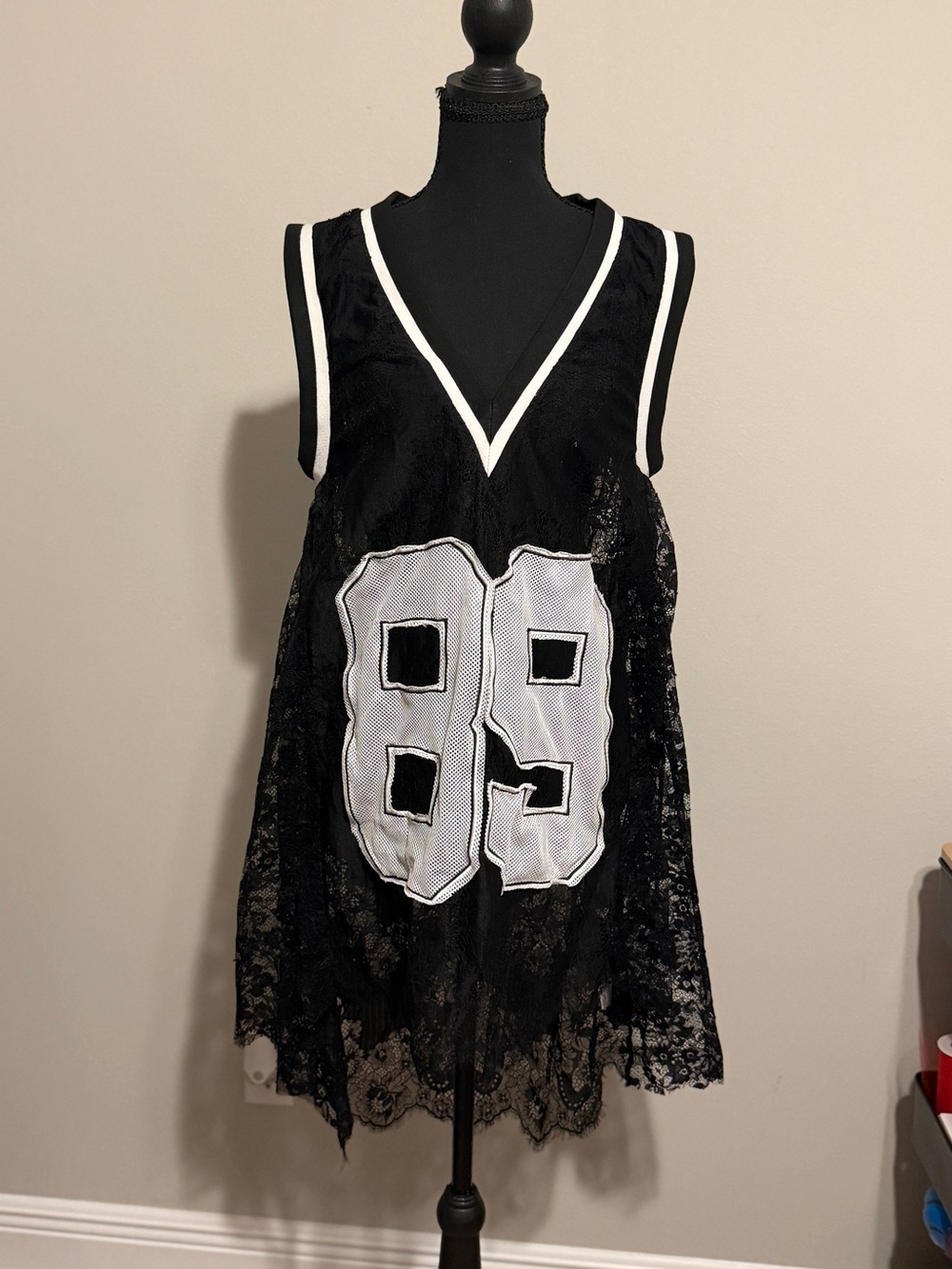 AKIRA Black Lace V-Neck Crop Top with White Number Appliqué